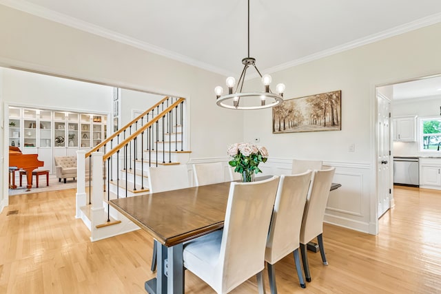 9118 Harrodsburg Rd, Wilmore, KY 40390 - dining space featuring ornamental molding, a chandelier, light wood-style flooring, and stairway
