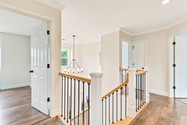 9118 Harrodsburg Rd, Wilmore, KY 40390 - hall featuring an upstairs landing, hardwood / wood-style flooring, baseboards, a chandelier, and crown molding