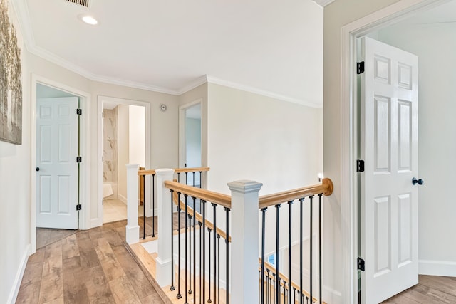 9118 Harrodsburg Rd, Wilmore, KY 40390 - corridor with an upstairs landing, light wood-style floors, ornamental molding, recessed lighting, and baseboards
