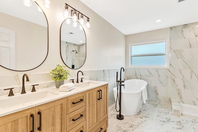 9118 Harrodsburg Rd, Wilmore, KY 40390 - bathroom with tile walls, a freestanding tub, marble finish floors, double vanity, and a shower