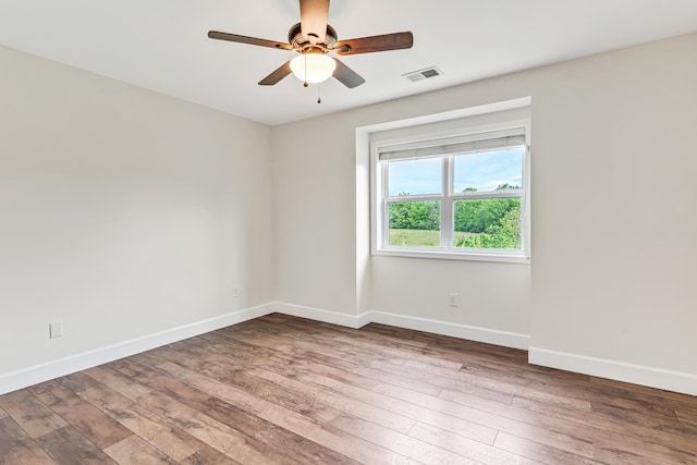9118 Harrodsburg Rd, Wilmore, KY 40390 - empty room featuring a ceiling fan, hardwood / wood-style flooring, and baseboards