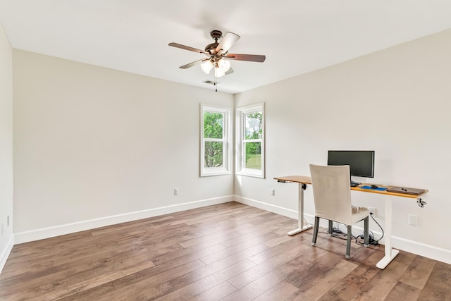 9118 Harrodsburg Rd, Wilmore, KY 40390 - unfurnished office with ceiling fan, baseboards, and wood-type flooring