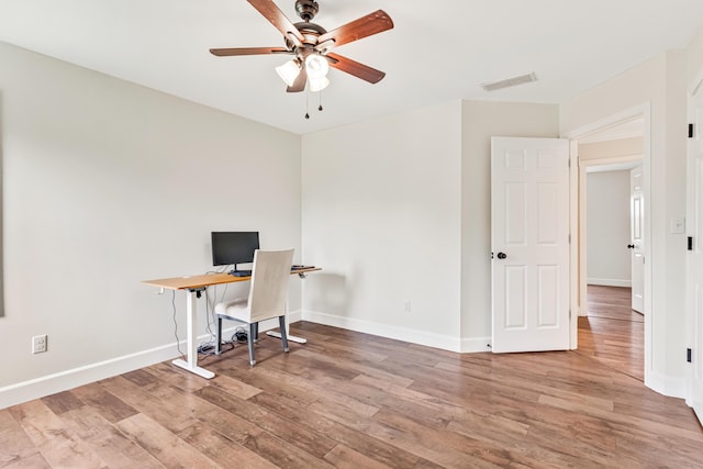 9118 Harrodsburg Rd, Wilmore, KY 40390 - office area featuring ceiling fan, wood finished floors, and baseboards