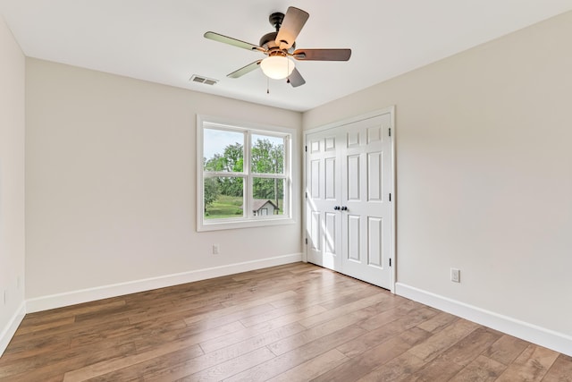9118 Harrodsburg Rd, Wilmore, KY 40390 - unfurnished bedroom with baseboards, wood-type flooring, and a closet