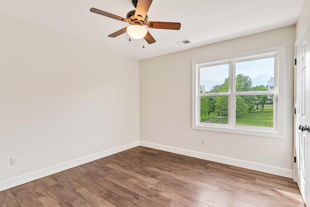 9118 Harrodsburg Rd, Wilmore, KY 40390 - spare room with baseboards, wood finished floors, and a ceiling fan