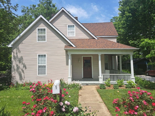 204 S Walnut St, Wilmore, KY 40390 - view of front of house featuring covered porch, roof with shingles, a front yard, and a chimney
