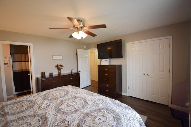 bedroom with dark wood finished floors, a closet, baseboards, and ceiling fan