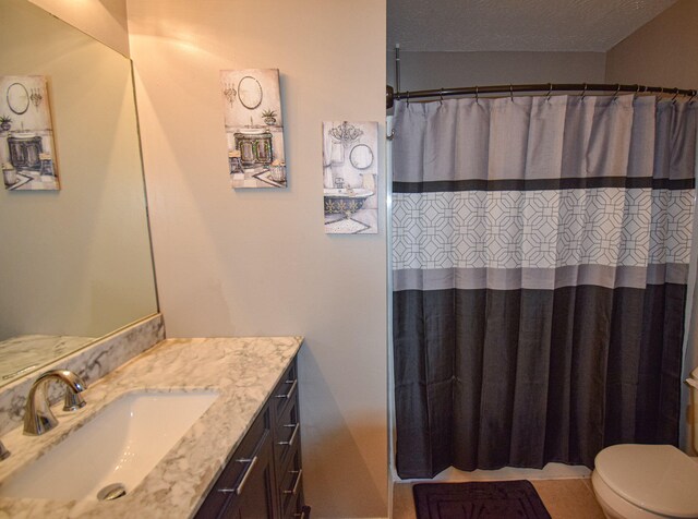 bathroom with vanity, toilet, and a shower with curtain