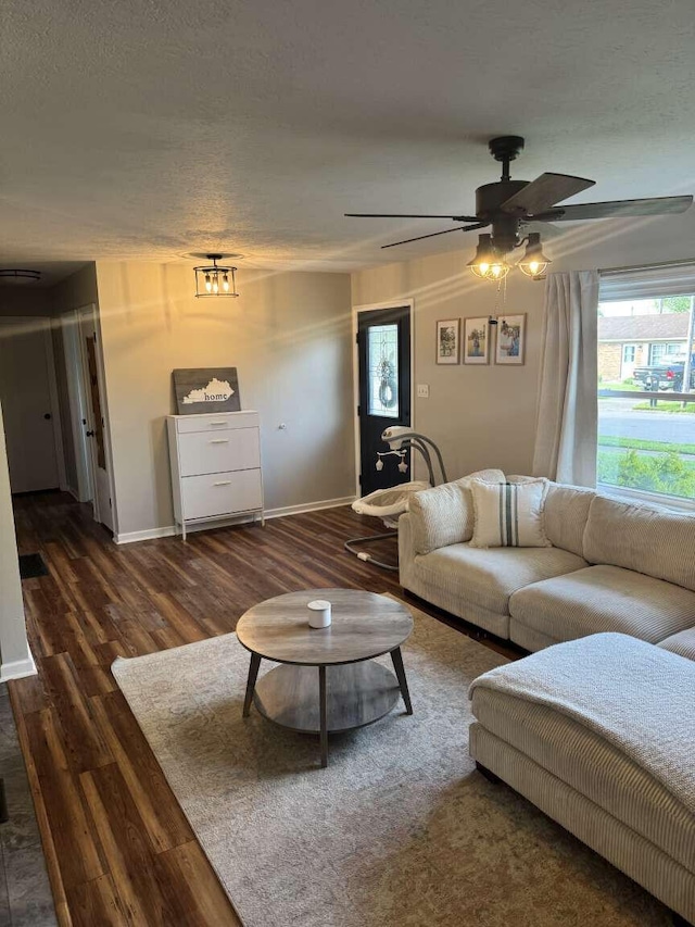 780 Nancy St, Versailles, KY 40383 - living room featuring wood finished floors, a ceiling fan, baseboards, and a textured ceiling