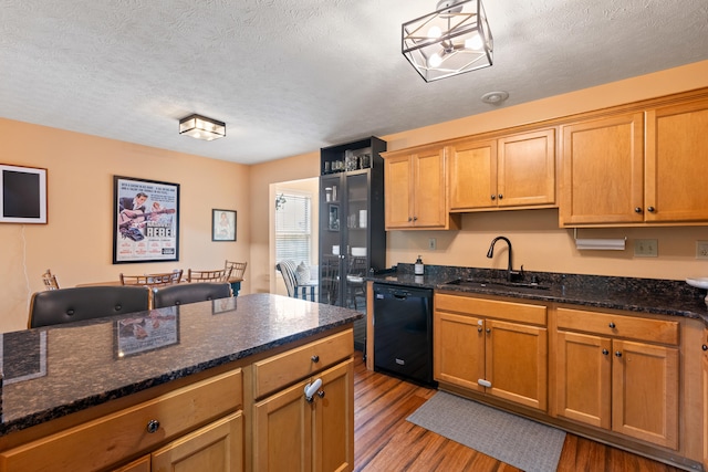 829 Lauderdale Dr, Lexington, KY 40515 - kitchen with black dishwasher, light wood-style floors, a textured ceiling, and dark stone counters