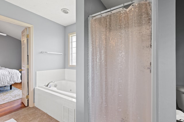 829 Lauderdale Dr, Lexington, KY 40515 - ensuite bathroom featuring a whirlpool tub, tile patterned flooring, and a shower with shower curtain