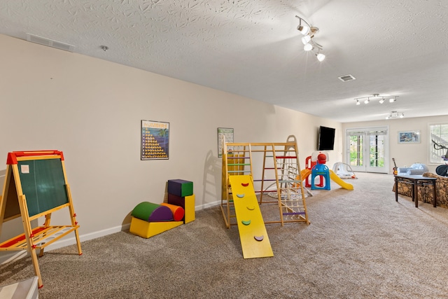 829 Lauderdale Dr, Lexington, KY 40515 - playroom featuring track lighting, carpet flooring, and a textured ceiling