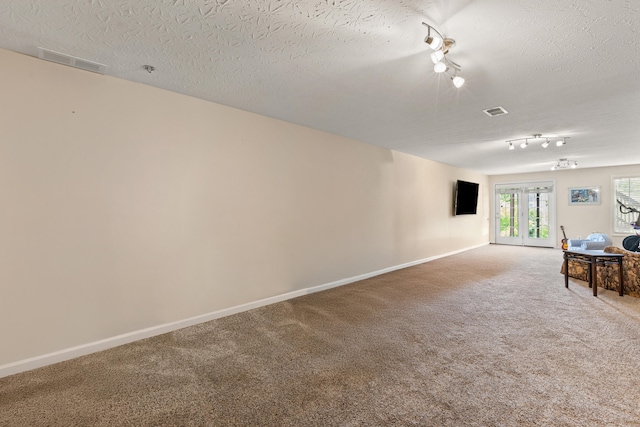 829 Lauderdale Dr, Lexington, KY 40515 - spare room with track lighting, carpet, and a textured ceiling