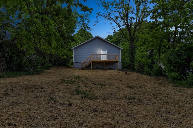 back of house with a wooden deck, crawl space, and stairs