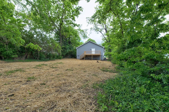 view of yard featuring a wooden deck