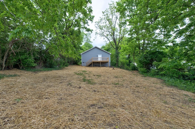 view of yard featuring a wooden deck