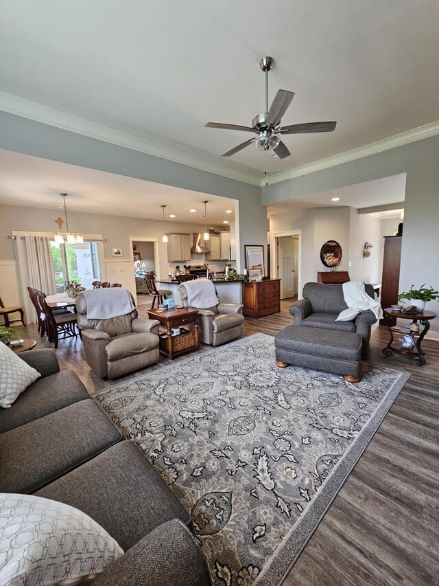 229 Old Station Rd, Frankfort, KY 40601 - living area with crown molding, a chandelier, dark wood-type flooring, a ceiling fan, and baseboards