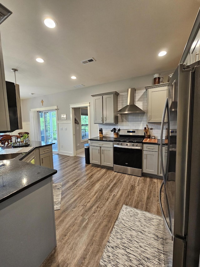 229 Old Station Rd, Frankfort, KY 40601 - kitchen featuring stainless steel appliances, wall chimney exhaust hood, dark countertops, a sink, and tasteful backsplash