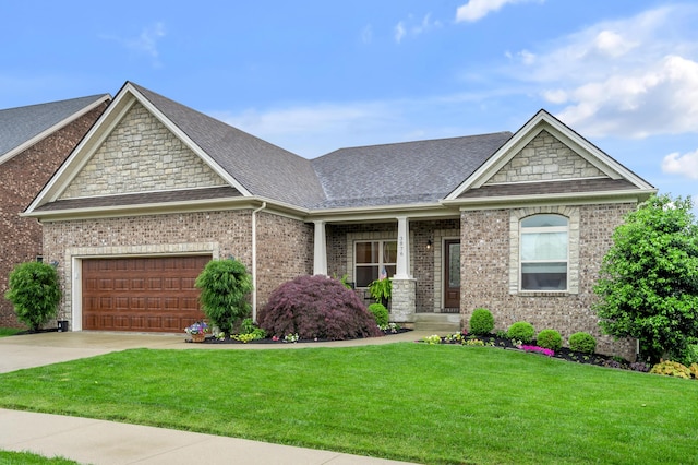 craftsman inspired home featuring a shingled roof, a front yard, concrete driveway, a garage, and brick siding
