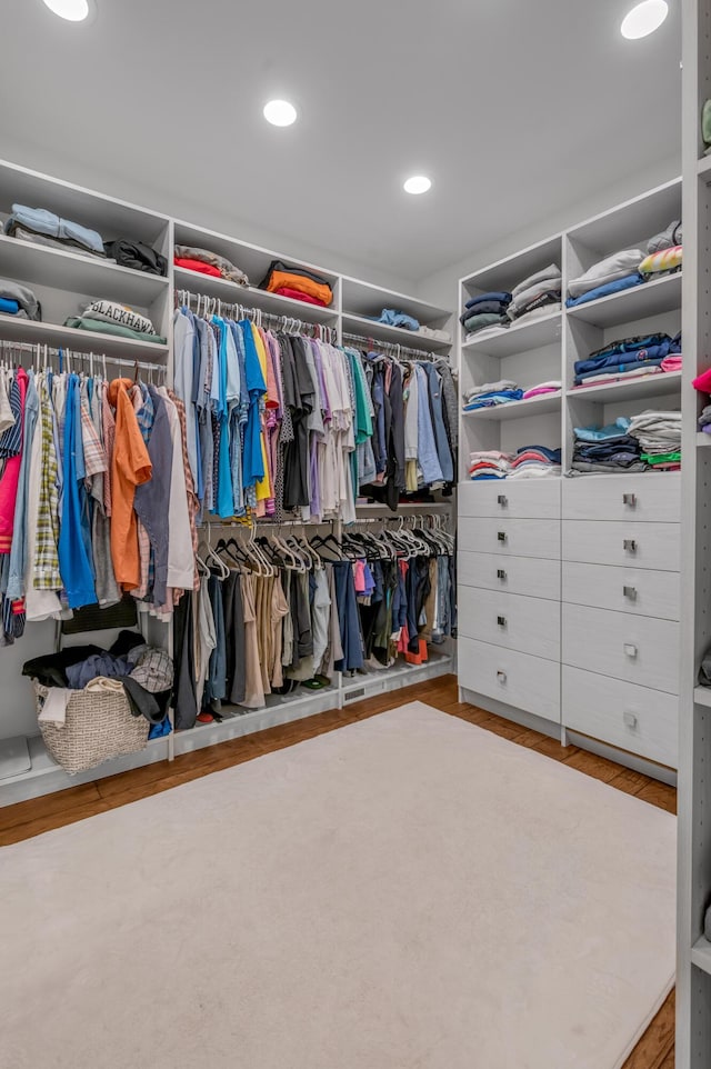 spacious closet with wood finished floors