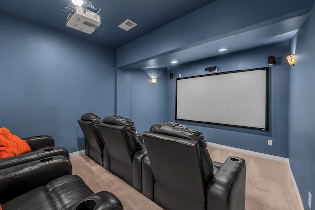 carpeted cinema room featuring baseboards