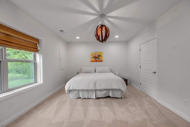 bedroom featuring light colored carpet, recessed lighting, and baseboards