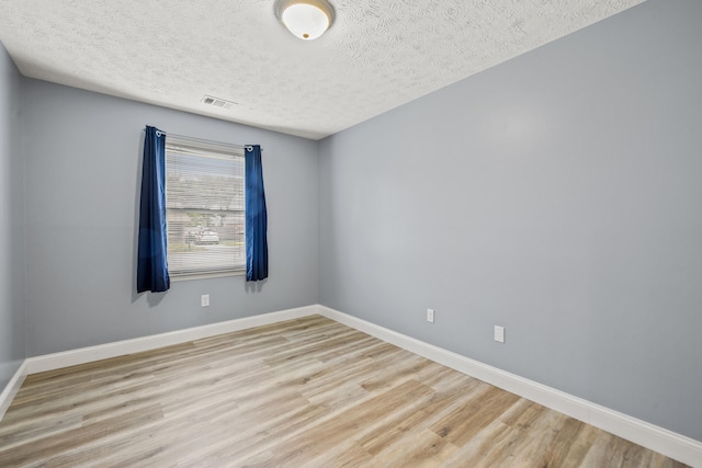 120 Chestnut Ln, Versailles, KY 40383 - unfurnished room featuring light wood-type flooring, a textured ceiling, and baseboards