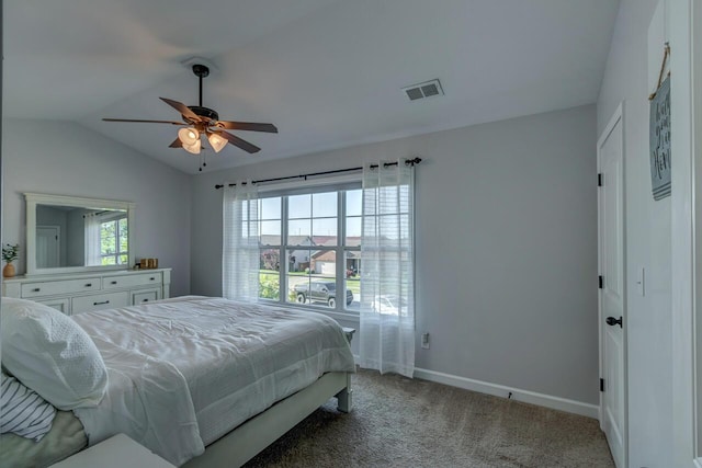 bedroom featuring vaulted ceiling, baseboards, light colored carpet, and a ceiling fan