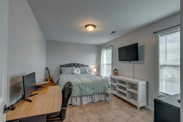 carpeted bedroom with baseboards