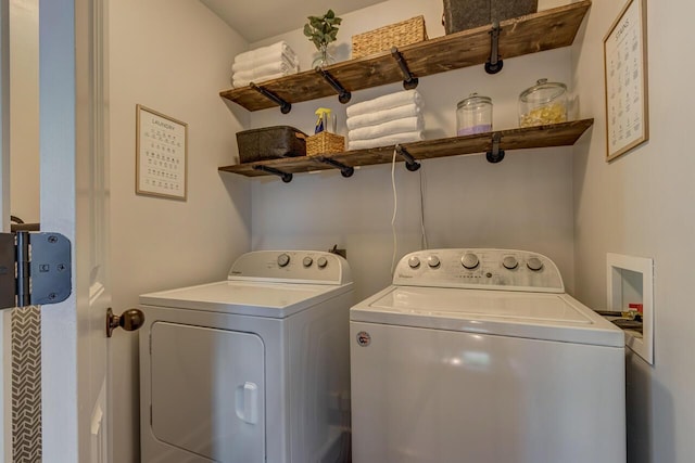 clothes washing area featuring washer and clothes dryer