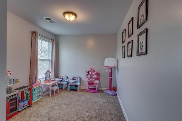 rec room with carpet flooring and baseboards