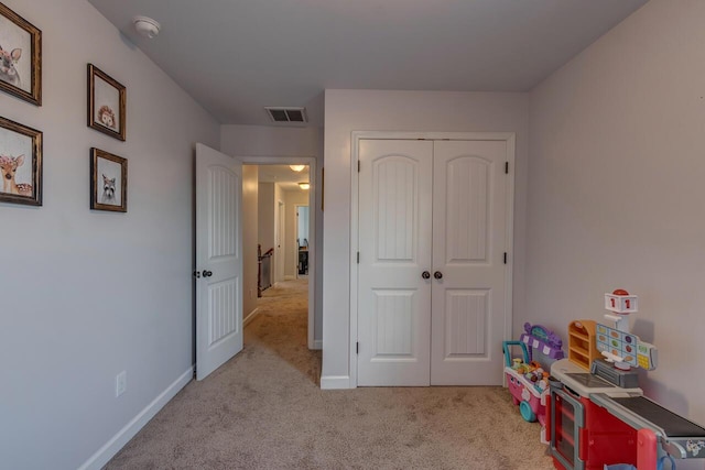recreation room featuring carpet and baseboards