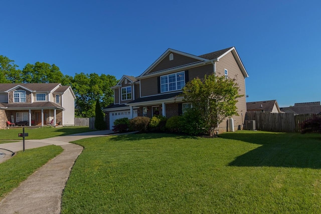 view of front of house featuring concrete driveway, a garage, and central air condition unit