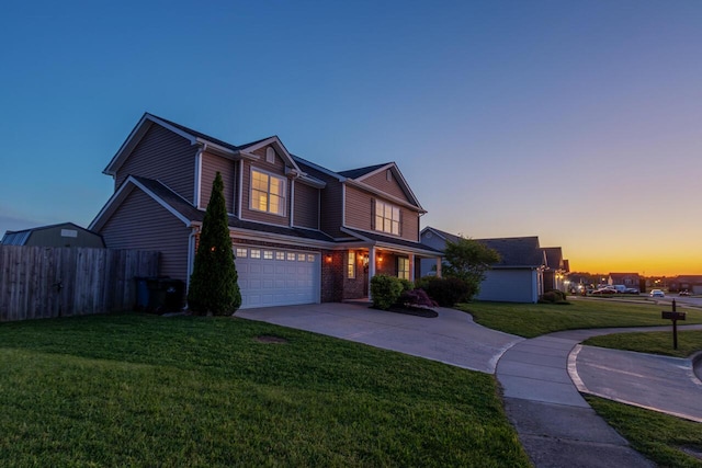 traditional-style house featuring an attached garage and driveway