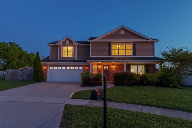 traditional-style house featuring an attached garage, driveway, and brick siding