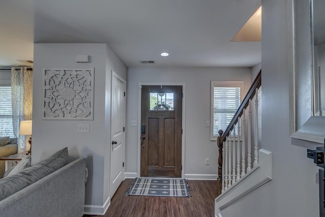 entryway with dark wood-style flooring, baseboards, recessed lighting, and stairway