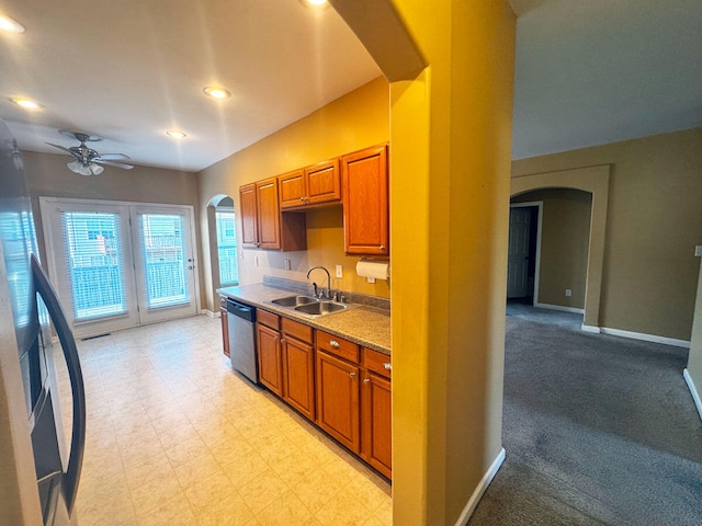 136 Janice Dr, Nicholasville, KY 40356 - kitchen with arched walkways, a sink, dishwasher, ceiling fan, and baseboards