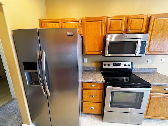 136 Janice Dr, Nicholasville, KY 40356 - kitchen featuring appliances with stainless steel finishes and brown cabinetry