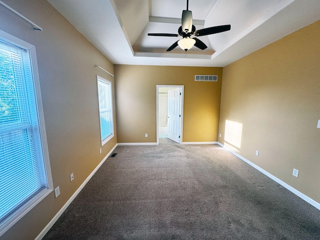 136 Janice Dr, Nicholasville, KY 40356 - carpeted spare room with a tray ceiling, a ceiling fan, and baseboards