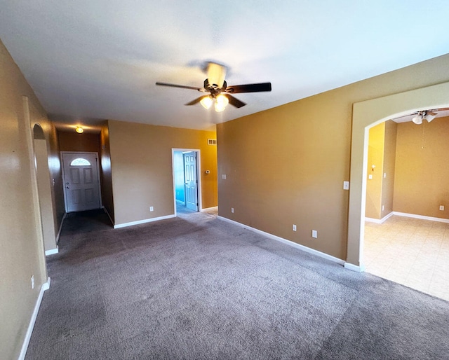 136 Janice Dr, Nicholasville, KY 40356 - empty room featuring arched walkways, a ceiling fan, carpet, and baseboards