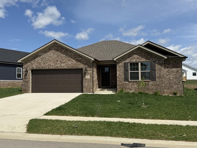 864 Denali Dr, Richmond, KY 40475 - ranch-style house with brick siding, a garage, driveway, a front lawn, and a shingled roof
