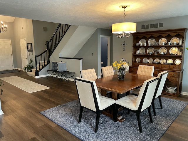 113 Paddock Ct, Frankfort, KY 40601 - dining room with a chandelier, wood finished floors, baseboards, and stairs