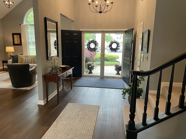 113 Paddock Ct, Frankfort, KY 40601 - entrance foyer featuring a chandelier, high vaulted ceiling, dark wood finished floors, and baseboards