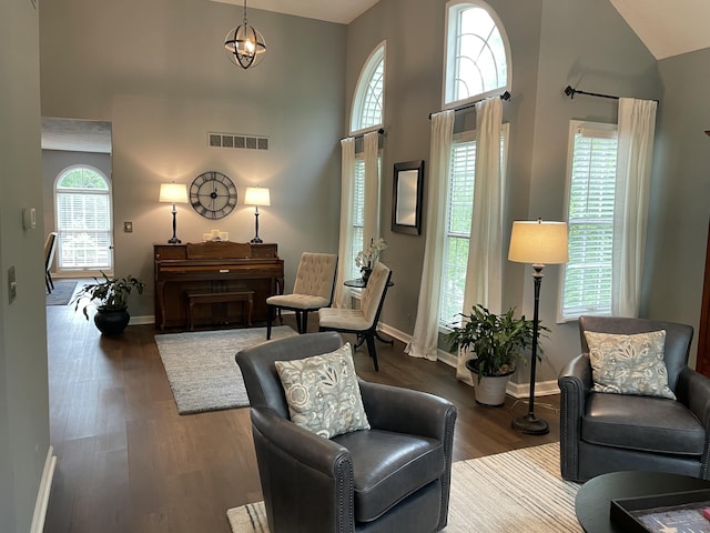 113 Paddock Ct, Frankfort, KY 40601 - living area featuring plenty of natural light, high vaulted ceiling, wood finished floors, and baseboards