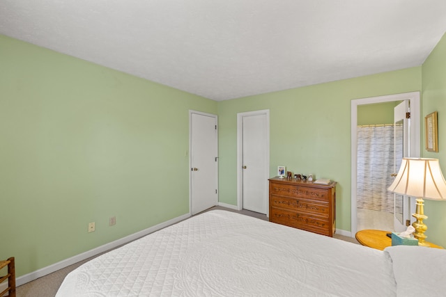 carpeted bedroom with baseboards