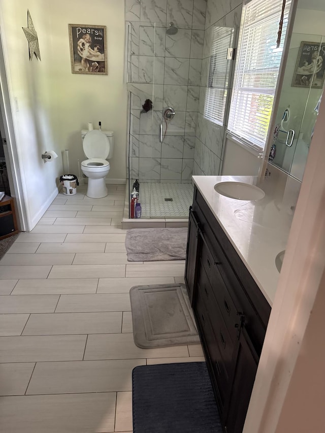 2789 Steadmantown Ln, Frankfort, KY 40601 - bathroom featuring a stall shower, baseboards, toilet, double vanity, and wood finish floors