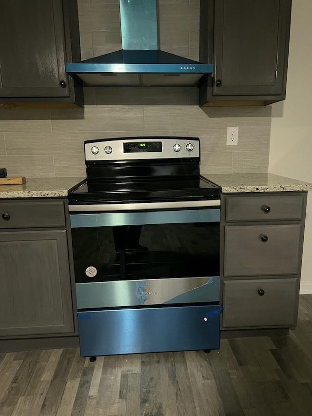 2789 Steadmantown Ln, Frankfort, KY 40601 - kitchen with electric range, wall chimney exhaust hood, gray cabinets, and dark wood-style flooring