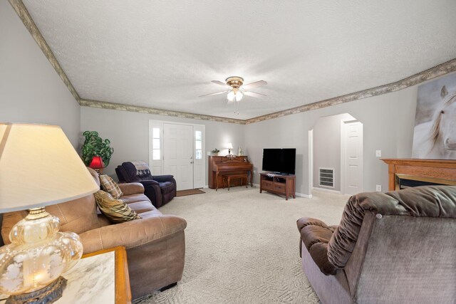 209 Brook Dr, Jeffersonville, KY 40337 - living room featuring carpet floors, a ceiling fan, a textured ceiling, baseboards, and arched walkways