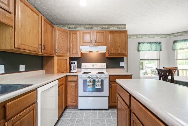 209 Brook Dr, Jeffersonville, KY 40337 - kitchen featuring white appliances, under cabinet range hood, light countertops, a textured ceiling, and brown cabinets