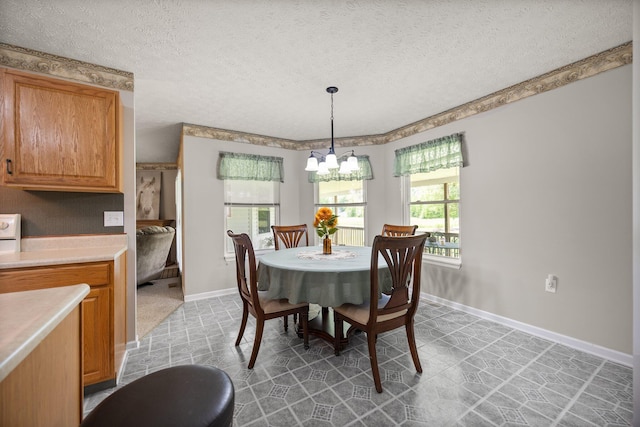 209 Brook Dr, Jeffersonville, KY 40337 - dining space with a textured ceiling, a chandelier, baseboards, and light tile patterned flooring